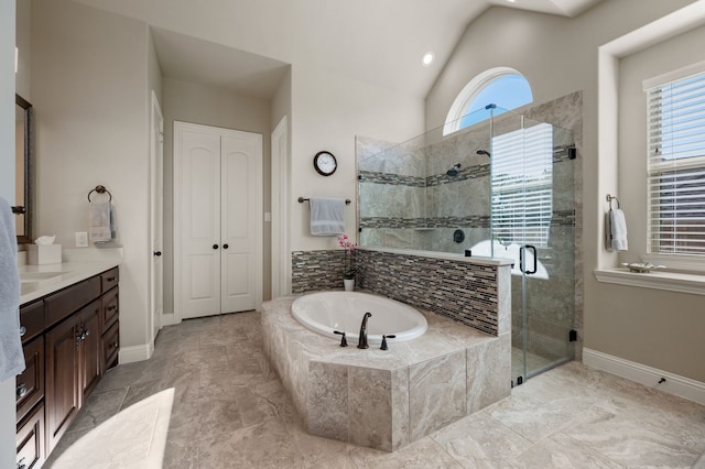 full bathroom featuring healthy amount of natural light, a bath, a shower stall, vanity, and lofted ceiling