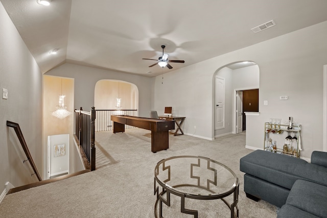 game room with arched walkways, light colored carpet, ceiling fan, baseboards, and vaulted ceiling