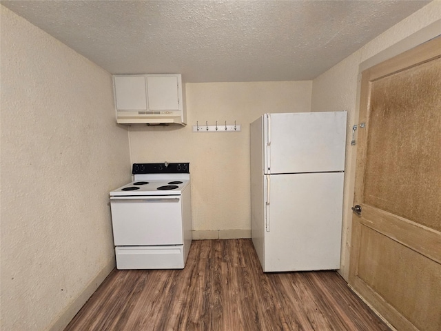 kitchen with white cabinetry, white appliances, a textured wall, and dark wood finished floors