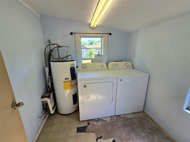 laundry room with laundry area, water heater, a textured ceiling, baseboards, and independent washer and dryer