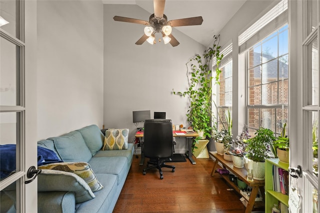 office space with vaulted ceiling, ceiling fan, and wood finished floors