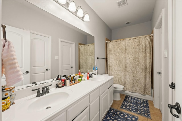 bathroom with a sink, tile patterned flooring, toilet, and visible vents