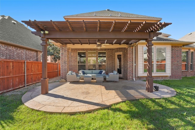 back of property with a patio, a pergola, ceiling fan, brick siding, and an outdoor living space