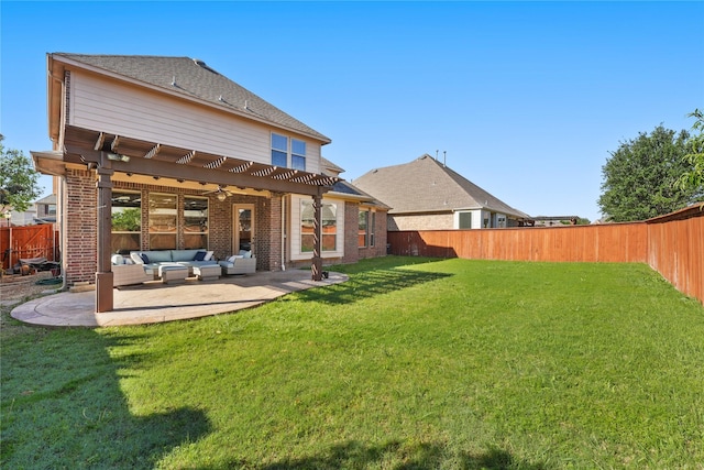back of house featuring a fenced backyard, a yard, a pergola, and outdoor lounge area