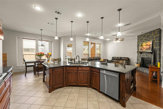 kitchen with a wealth of natural light, a sink, visible vents, and stainless steel dishwasher