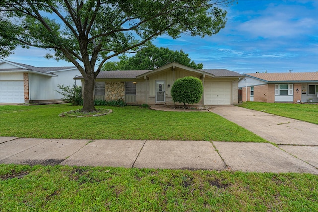 ranch-style home with a front yard, concrete driveway, and a garage
