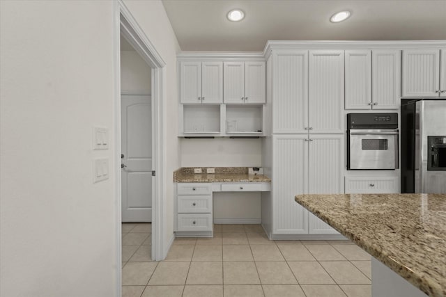 kitchen featuring open shelves, light tile patterned floors, white cabinets, light stone countertops, and appliances with stainless steel finishes
