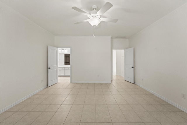 unfurnished room with baseboards, ornamental molding, visible vents, and ceiling fan