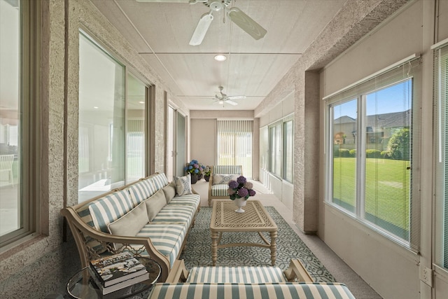 sunroom with ceiling fan, outdoor lounge area, and carpet floors
