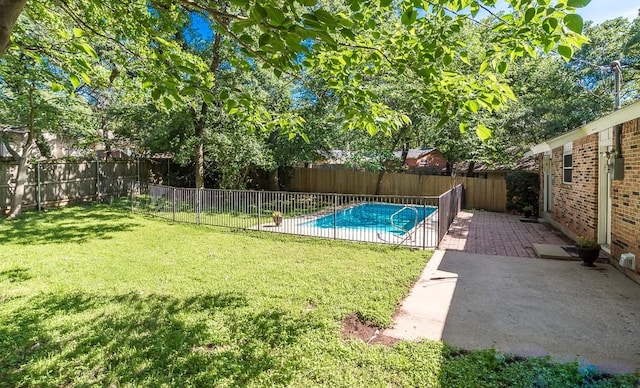 view of pool with a patio, a fenced in pool, a lawn, and a fenced backyard