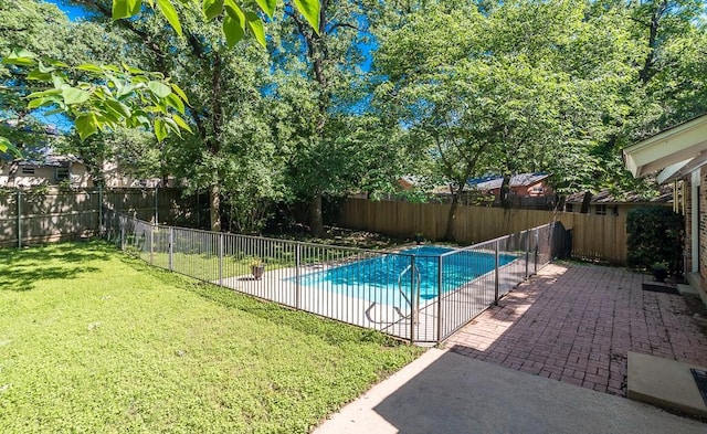 view of pool featuring a yard, a fenced in pool, a fenced backyard, and a patio area