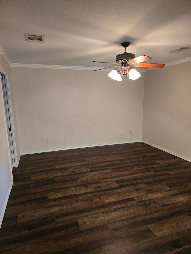spare room with visible vents, a ceiling fan, and ornamental molding