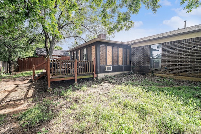 3811 Pelham Mnr, Arlington, TX 76016 - exterior space featuring a sunroom, fence, and a wooden deck