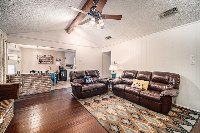 3811 Pelham Mnr, Arlington, TX 76016 - living room with a textured ceiling, visible vents, ceiling fan with notable chandelier, and dark wood-type flooring
