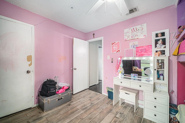 3811 Pelham Mnr, Arlington, TX 76016 - office with ceiling fan, visible vents, a textured ceiling, and wood finished floors