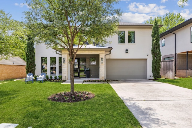 431 Blanning Dr, Dallas, TX 75218 - view of front of house featuring an attached garage, driveway, and a front yard