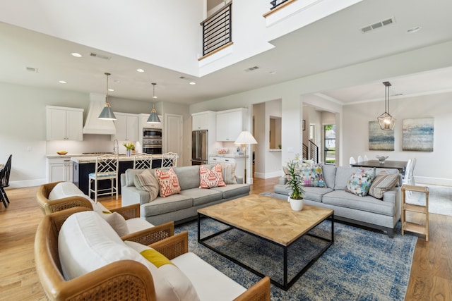 431 Blanning Dr, Dallas, TX 75218 - living room with light wood finished floors, baseboards, visible vents, and recessed lighting