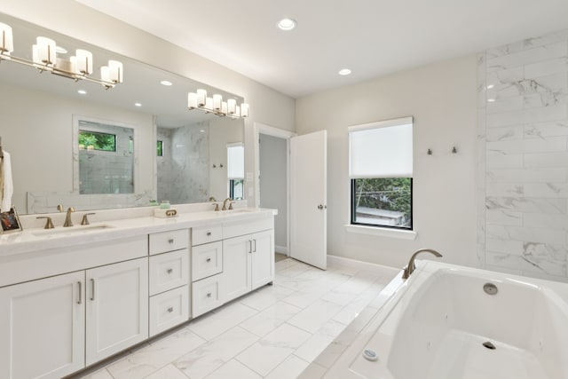 431 Blanning Dr, Dallas, TX 75218 - bathroom featuring recessed lighting, a tub with jets, marble finish floor, and a sink