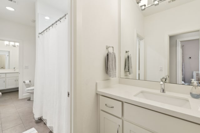 431 Blanning Dr, Dallas, TX 75218 - full bathroom with toilet, tile patterned flooring, vanity, and recessed lighting