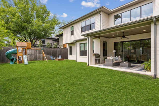 431 Blanning Dr, Dallas, TX 75218 - back of property featuring an outdoor living space, a playground, a yard, and a fenced backyard