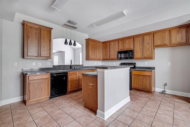 1001 Benjamin Dr, Burleson, TX 76028 - kitchen with brown cabinetry, black appliances, and a sink