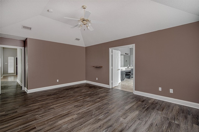 1001 Benjamin Dr, Burleson, TX 76028 - spare room with a ceiling fan, visible vents, baseboards, lofted ceiling, and dark wood-style floors