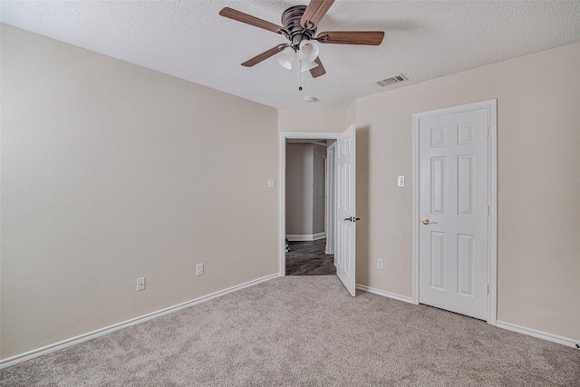 1001 Benjamin Dr, Burleson, TX 76028 - unfurnished bedroom featuring carpet flooring, a textured ceiling, visible vents, and a ceiling fan