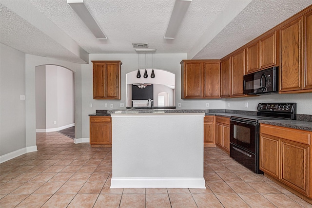 1001 Benjamin Dr, Burleson, TX 76028 - kitchen featuring light tile patterned floors, brown cabinets, black appliances, and arched walkways
