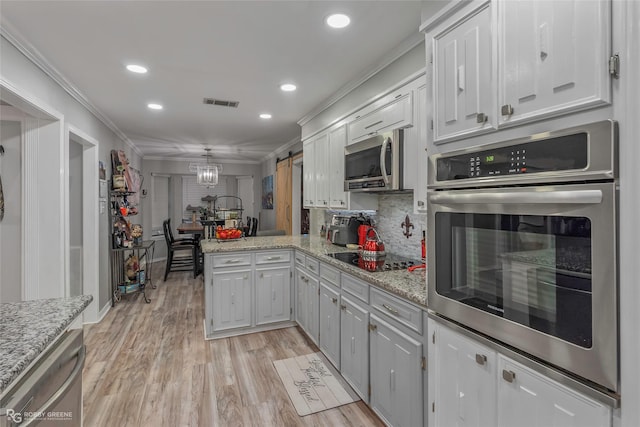 103 Maple Leaf Ln, Haughton, LA 71037 - kitchen with ornamental molding, stainless steel appliances, a peninsula, and visible vents