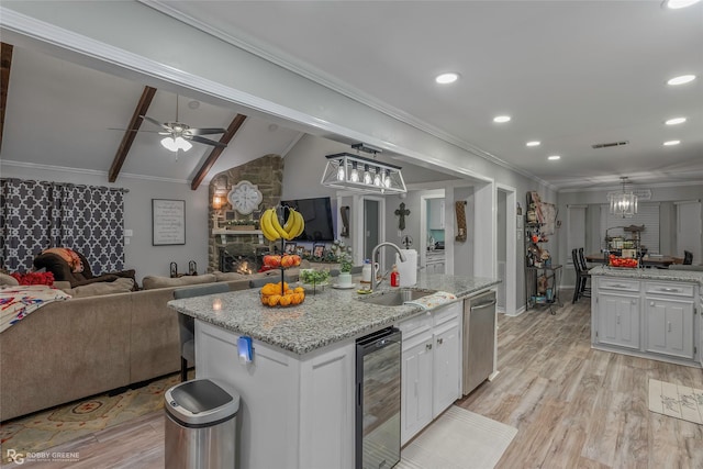 103 Maple Leaf Ln, Haughton, LA 71037 - kitchen with ornamental molding, beverage cooler, open floor plan, and a sink