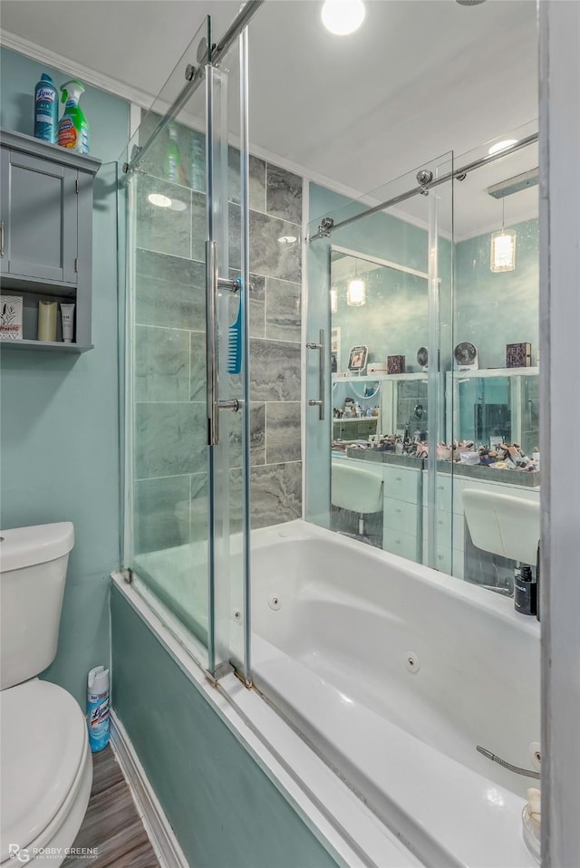 103 Maple Leaf Ln, Haughton, LA 71037 - full bath featuring a combined bath / shower with jetted tub, toilet, baseboards, and wood finished floors
