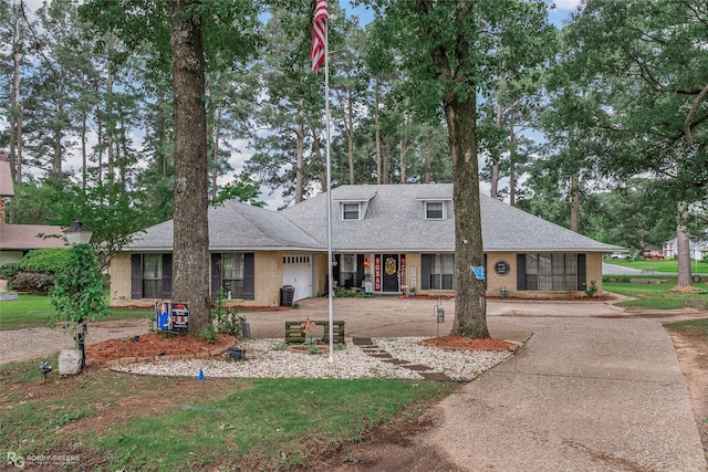 103 Maple Leaf Ln, Haughton, LA 71037 - ranch-style home with concrete driveway, an attached garage, a shingled roof, and brick siding