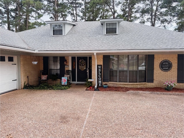 103 Maple Leaf Ln, Haughton, LA 71037 - view of front of property featuring a shingled roof, brick siding, a porch, and driveway