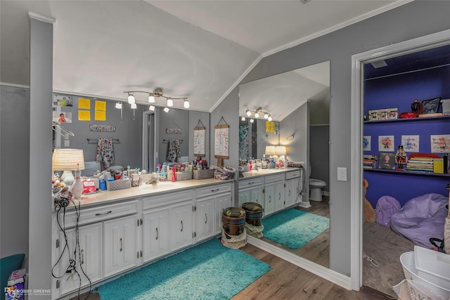 103 Maple Leaf Ln, Haughton, LA 71037 - bathroom with double vanity, wood finished floors, a sink, and crown molding