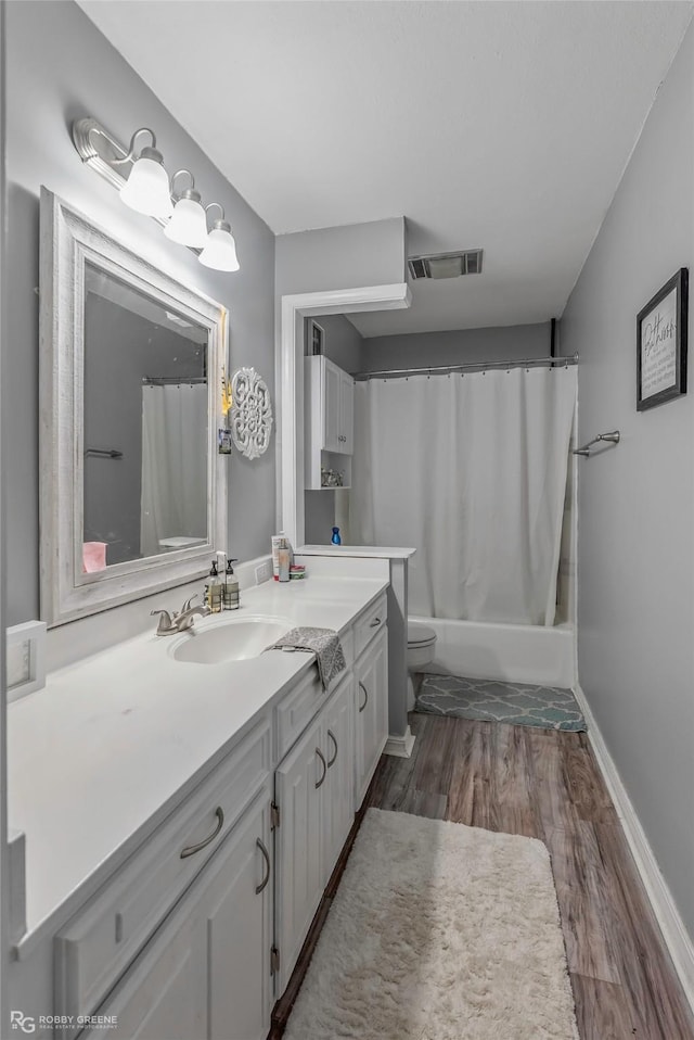 103 Maple Leaf Ln, Haughton, LA 71037 - bathroom featuring vanity, wood finished floors, and shower / tub combo