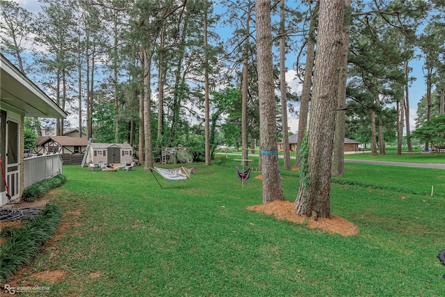 103 Maple Leaf Ln, Haughton, LA 71037 - view of yard featuring a storage unit and an outdoor structure