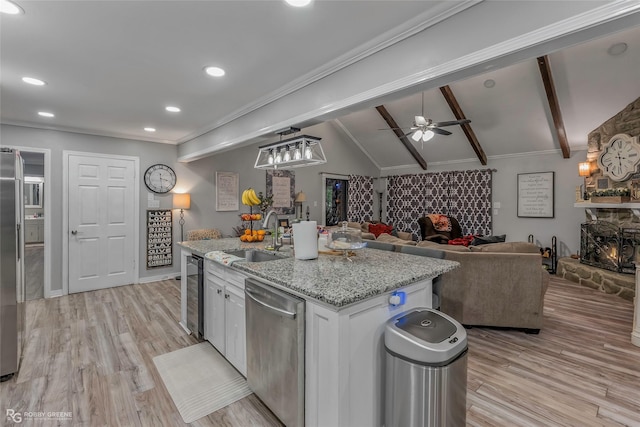 103 Maple Leaf Ln, Haughton, LA 71037 - kitchen with a sink, stainless steel appliances, vaulted ceiling with beams, white cabinetry, and wine cooler