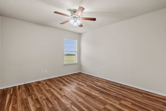 unfurnished room with ceiling fan, baseboards, and wood finished floors