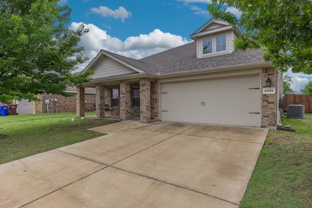 view of front of home featuring concrete driveway, roof with shingles, brick siding, and a front lawn