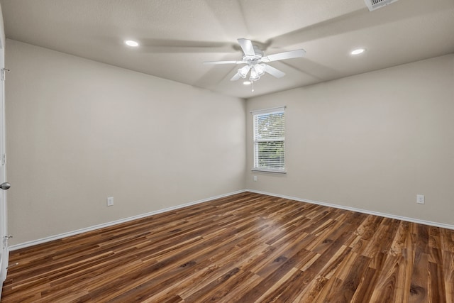 unfurnished room featuring a ceiling fan, baseboards, recessed lighting, and dark wood-style floors