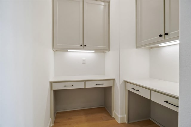 629 Hummingbird Dr, Aledo, TX 76008 - unfurnished office featuring built in study area, light wood finished floors, and baseboards