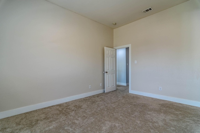 empty room with carpet flooring and baseboards