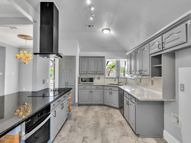 kitchen with stainless steel appliances, gray cabinetry, exhaust hood, a sink, and crown molding