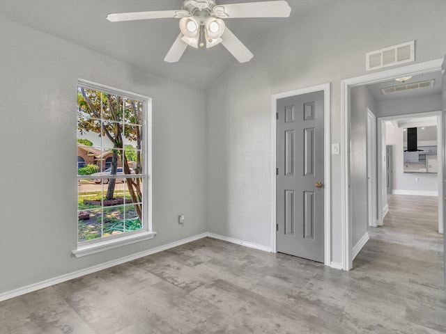 unfurnished room featuring a ceiling fan, lofted ceiling, and baseboards