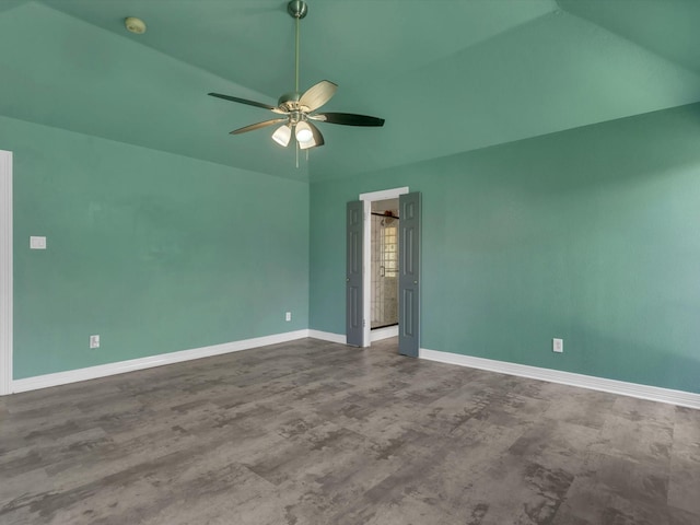 spare room featuring vaulted ceiling, a ceiling fan, baseboards, a smoke detector, and wood finished floors