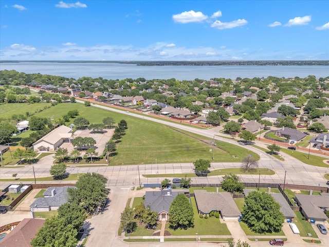 aerial view of residential area with a large body of water