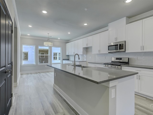 3356 Norris St, Plano, TX 75074 - kitchen featuring white cabinets, appliances with stainless steel finishes, decorative backsplash, and a sink