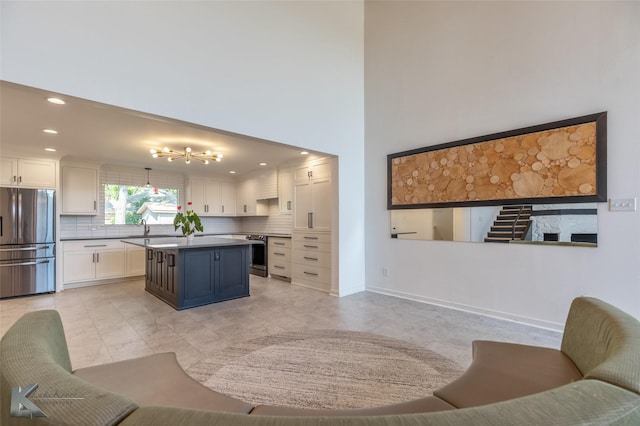 718 Byrd Dr, Abilene, TX 79601 - kitchen featuring stainless steel appliances, white cabinets, decorative backsplash, and recessed lighting