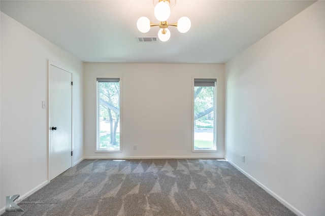 718 Byrd Dr, Abilene, TX 79601 - spare room with plenty of natural light, carpet floors, and a chandelier