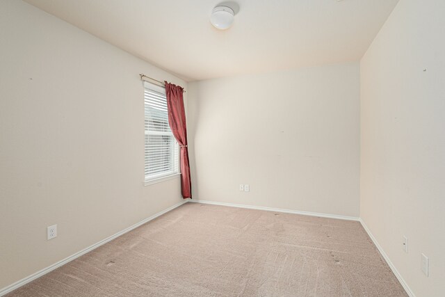 732 Harrison Ln, Lavon, TX 75166 - spare room featuring light colored carpet and baseboards